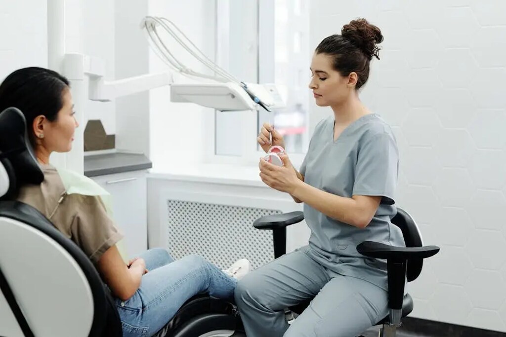 a woman sitting in dentist chair preparing for examination at RTC Dental in McLean for Invisalign Reston services.