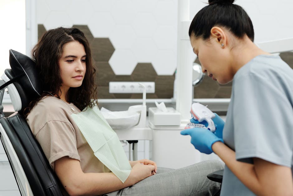 a woman and a man are using a remote control  at RTC Dental in Sterling for Cosmetic dentist Reston services.