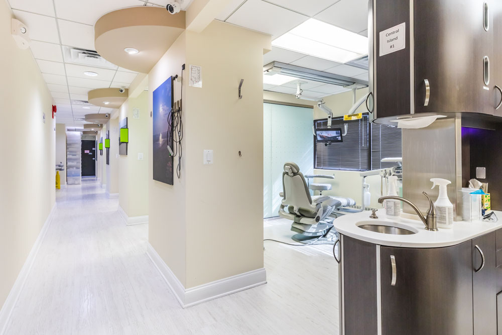 a large room with a large mirror and a large sink  at RTC Dental in Great Falls for Reston dental office services.