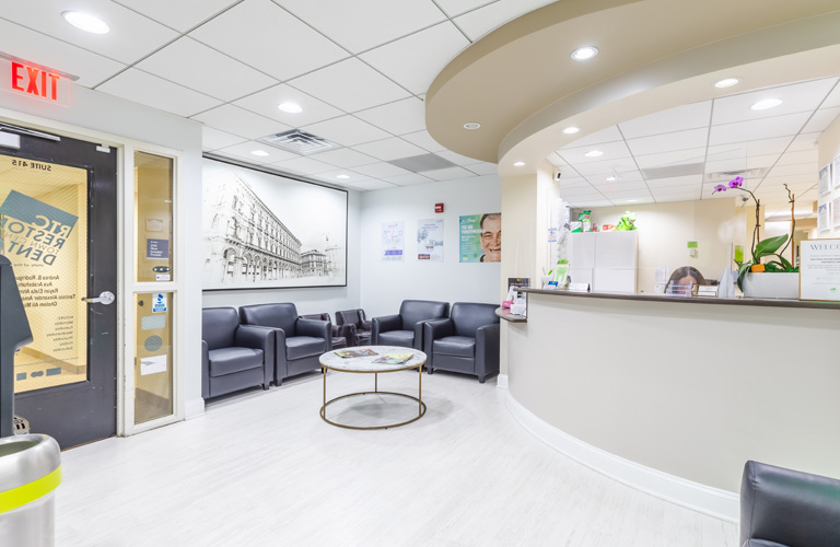 a living room with a large window and a large table  at RTC Dental in Arlington for Teeth whitening Reston services.