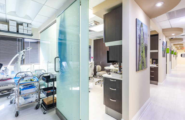 a kitchen with a refrigerator, microwave, and a counter  at RTC Dental in Ashburn for RTC Dental Reston services.