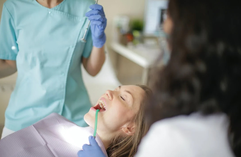 woman in dentist office for emergency visit at RTC Dental in Chantilly for Pediatric dentist Reston services.