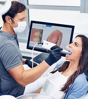 a woman is blow drying a man's hair  at RTC Dental in Reston, VA for Emergency dentist Reston services.