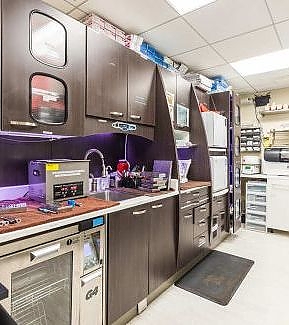 a kitchen with a large counter top and a large refrigerator  at RTC Dental in McLean for Invisalign Reston services.