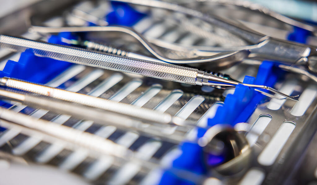 a pair of scissors sitting on top of a table  at RTC Dental in Reston, VA for Emergency dentist Reston services.