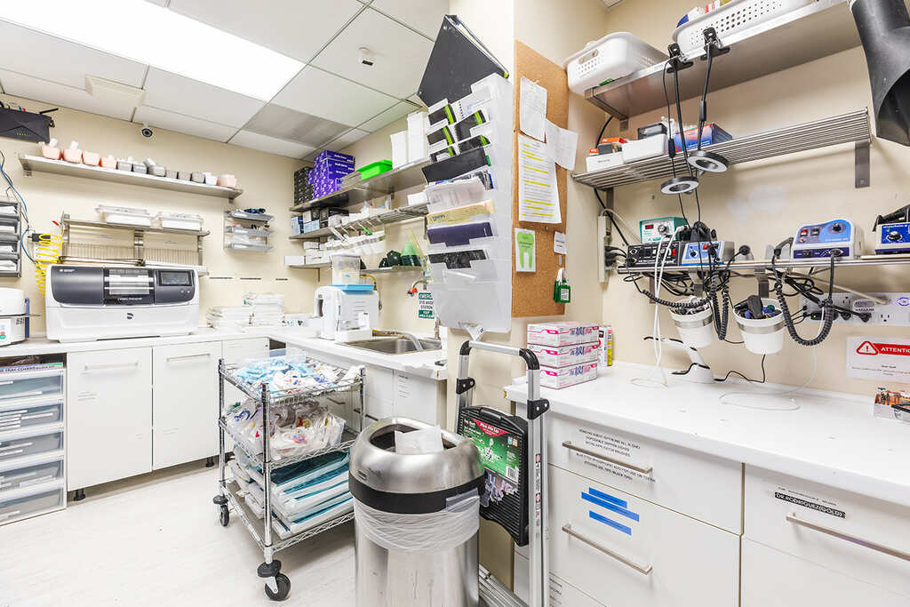 a hospital room with a lot of equipment  at RTC Dental in Ashburn for RTC Dental Reston services.