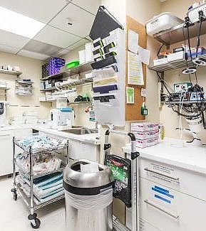 a hospital room with a lot of equipment  at RTC Dental in Ashburn for RTC Dental Reston services.