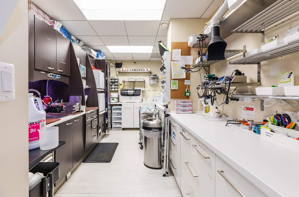 a kitchen with a lot of cabinets and a lot of appliances  at RTC Dental in Sterling for Cosmetic dentist Reston services.