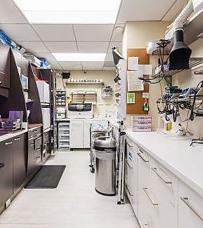 a kitchen with a lot of cabinets and a lot of appliances  at RTC Dental in Sterling for Cosmetic dentist Reston services.