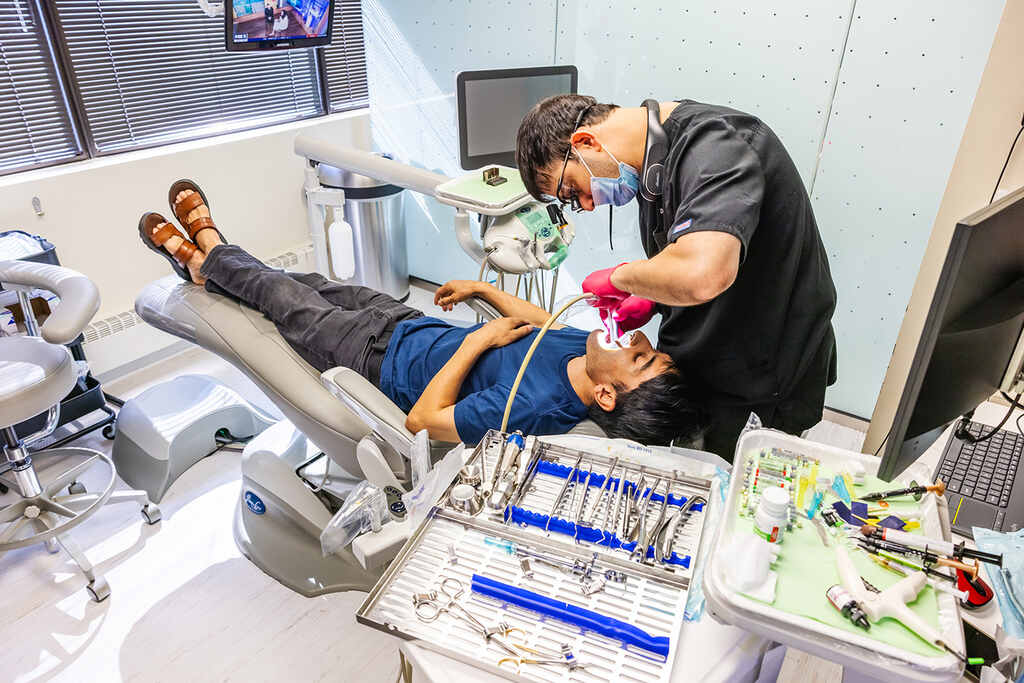 a man and a woman laying on a bed  at RTC Dental in Reston, VA for Emergency dentist Reston services.