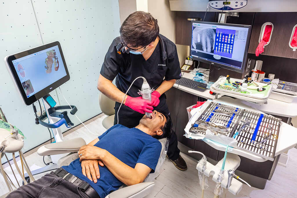 a woman is laying in a hospital bed  at RTC Dental in Chantilly for Pediatric dentist Reston services.