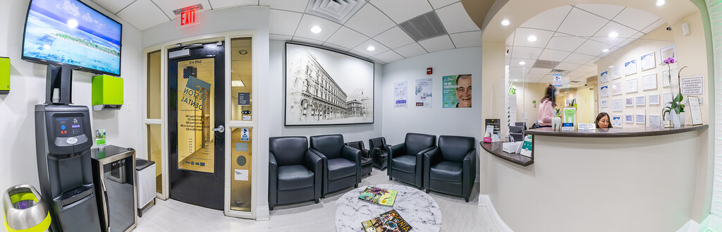 a living room with a couch, chairs and a television  at RTC Dental in Vienna for Family dentistry Reston services.