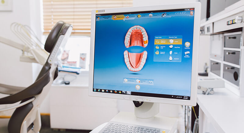 a computer screen with a cartoon character on it  at RTC Dental in Vienna for Family dentistry Reston services.