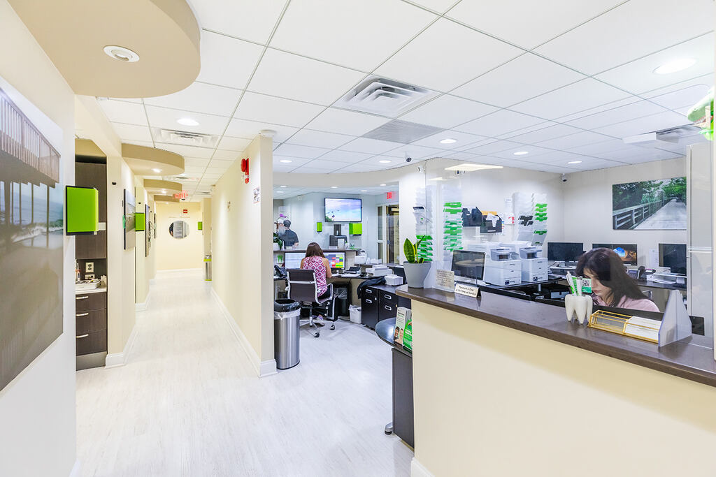 a kitchen with a large counter top and a large window  at RTC Dental in Oakton for Dental implants Reston services.