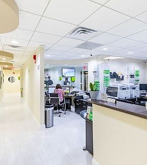 a kitchen with a large counter top and a large window  at RTC Dental in Oakton for Dental implants Reston services.